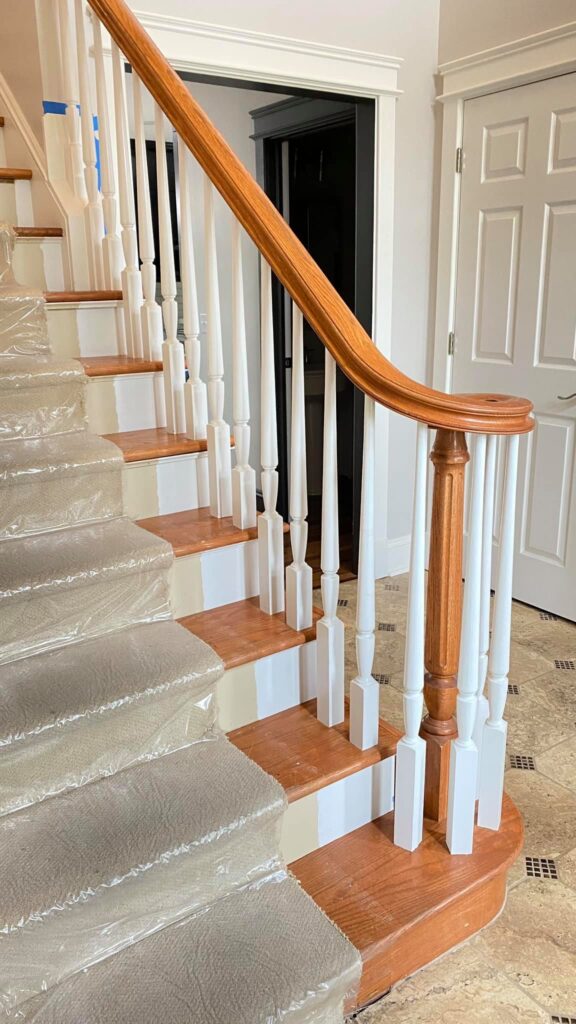 Wood and white painted staircase by Franc Painting in Akron, Ohio.