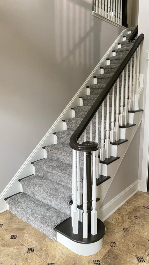 Black and white staircase design by Franc Painting in Akron, Ohio.