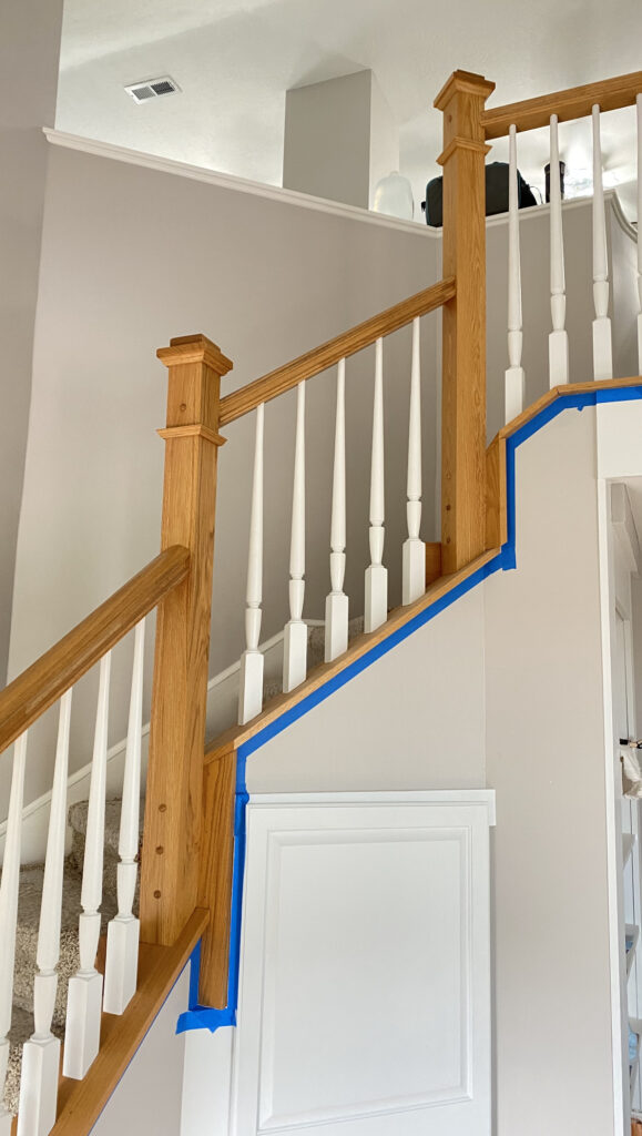 Traditional staircase with wood and white paint finish by Franc Painting in Akron, Ohio.