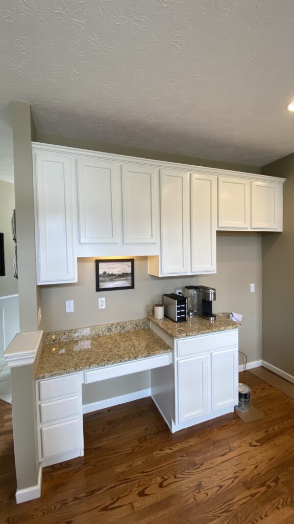 Cozy kitchen workspace with freshly painted cabinets by Franc Painting in Akron, Ohio.