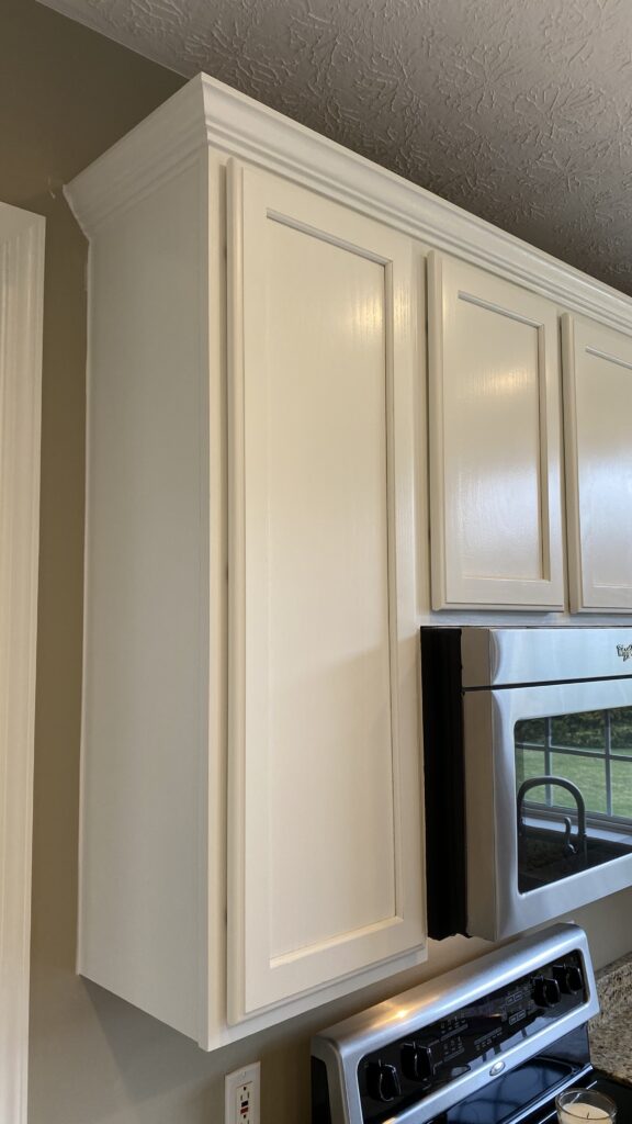 White kitchen cabinets with a fresh paint finish by Franc Painting in Akron, Ohio.