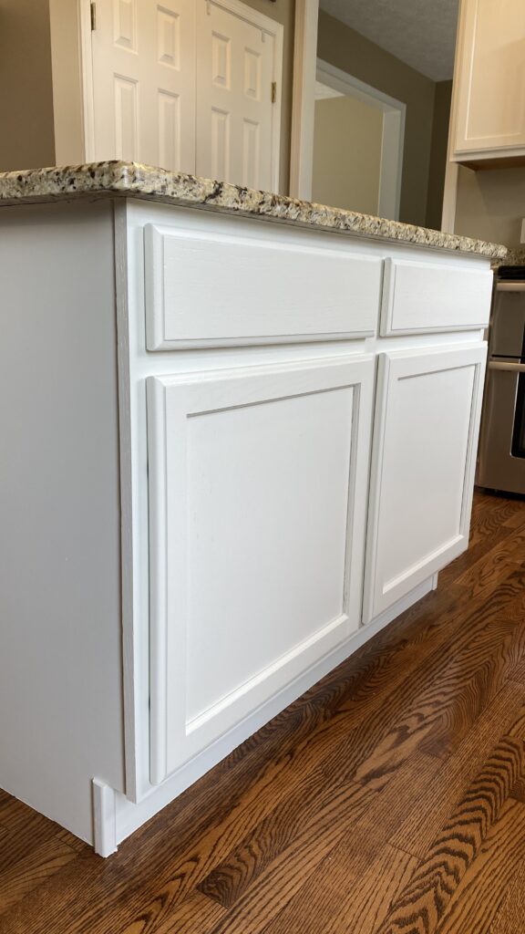 Painted kitchen cabinets with granite countertops by Franc Painting in Akron, Ohio.