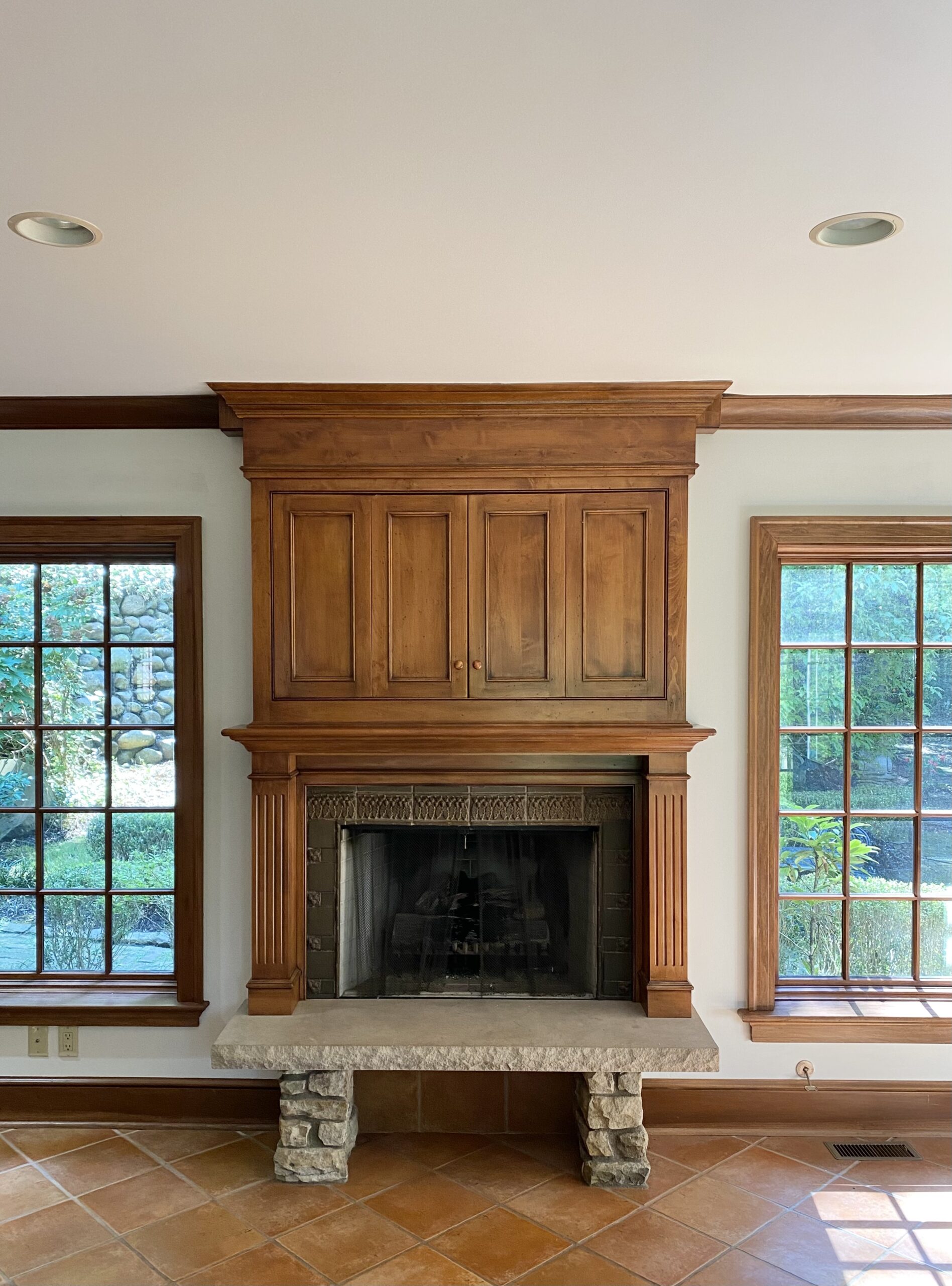 Fireplace with natural wood mantel and neutral-painted walls by Franc Painting in Akron, Ohio.