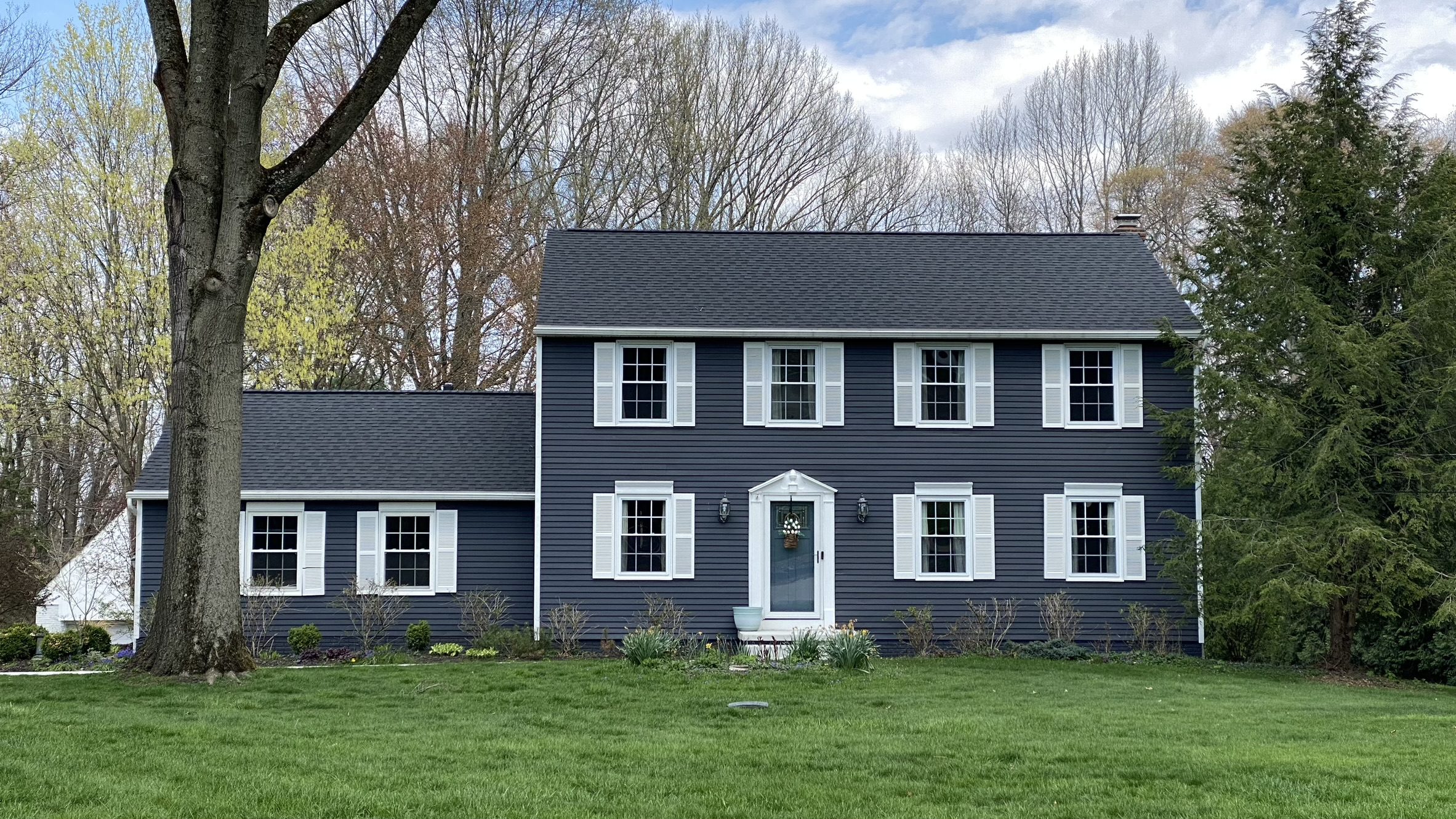 Professional painting contractor in Ohio preparing a home exterior before painting