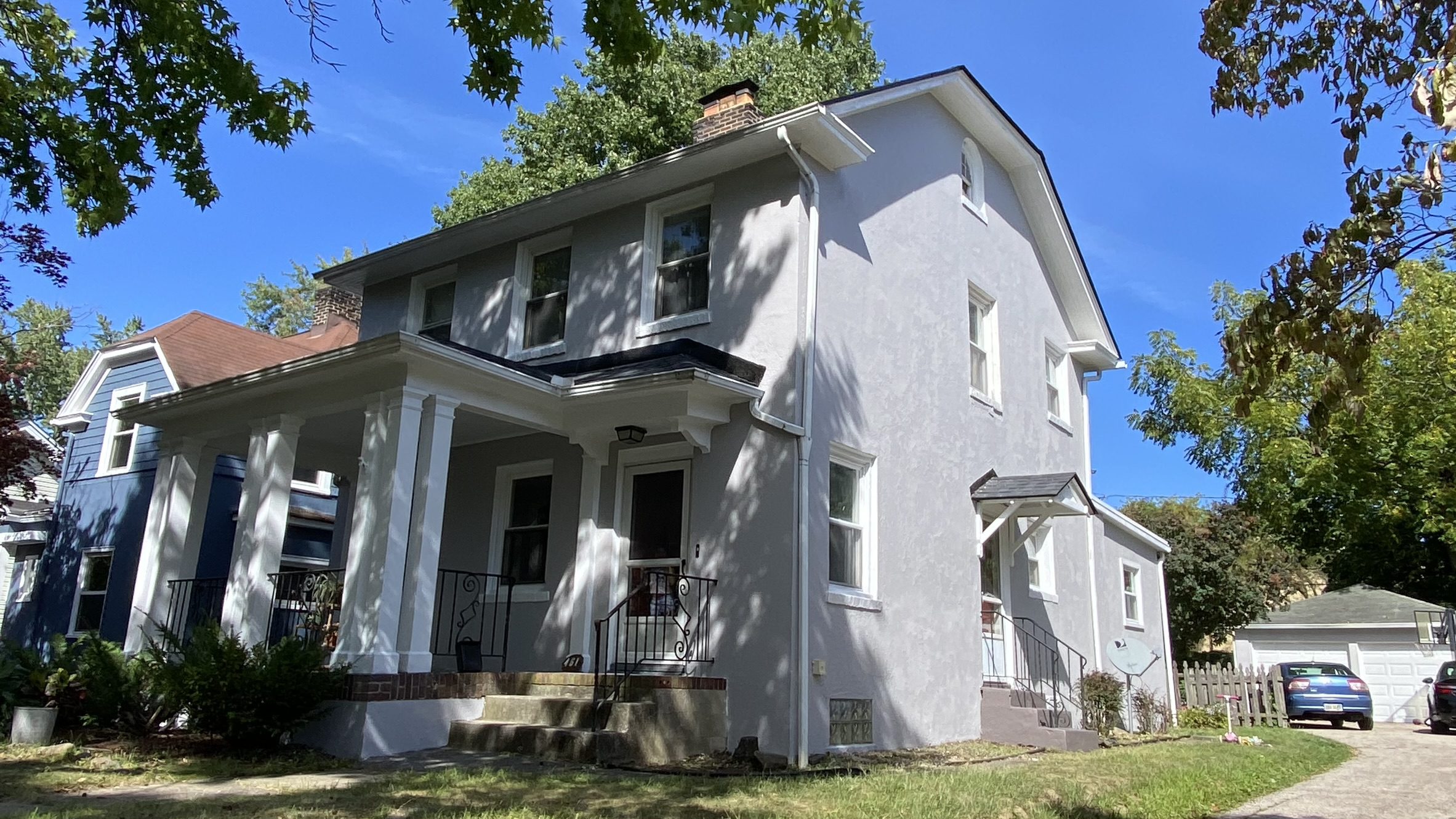 Fall exterior paint colors Akron OH home with warm neutral siding